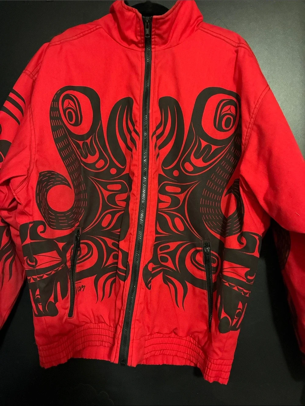 Red Puffer Jacket with Black Graphic Detailing